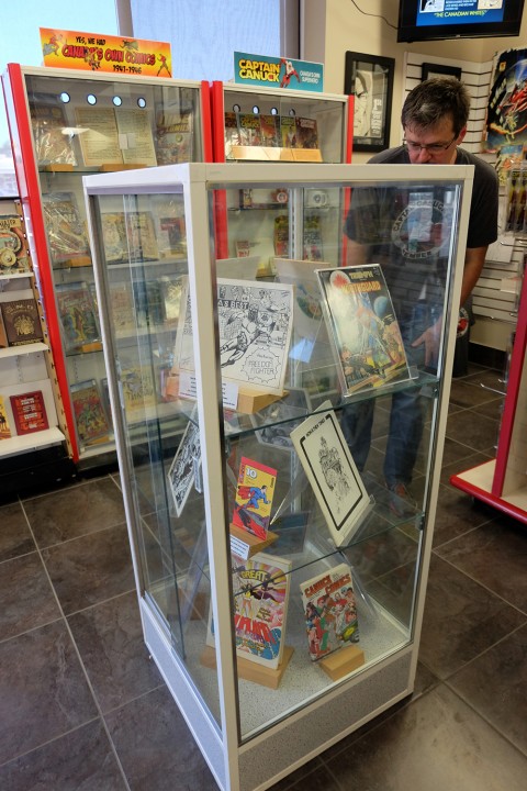 Short display case from front with Walt in background.