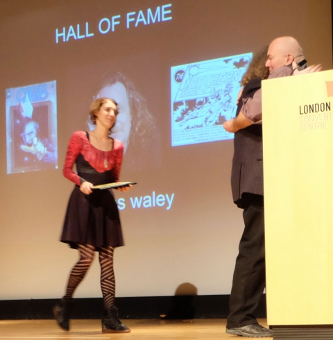 James Waley's daughter, Mary ready to present the Hall of Fame Award to her father while Ron Kasman congratulates James.